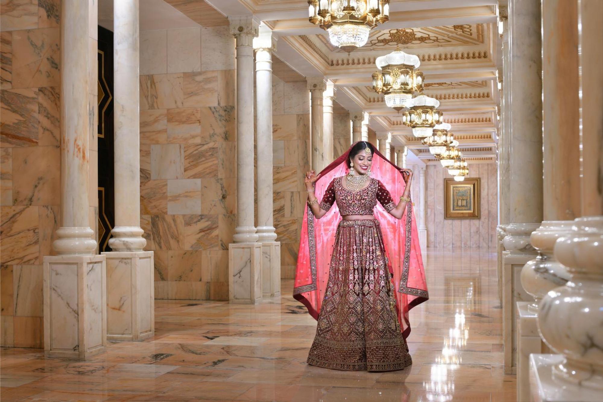 InterContinental Abu Dhabi, an IHG Hotel Bagian luar foto A woman in an embroidered anarkali suit